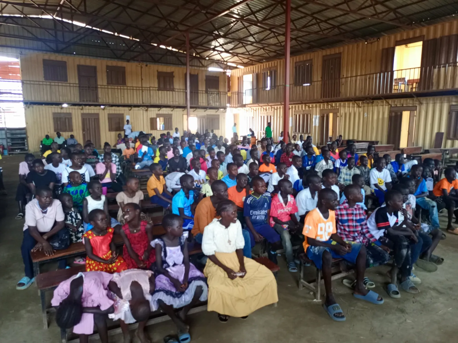 Students gathered in a Favor primary school hall